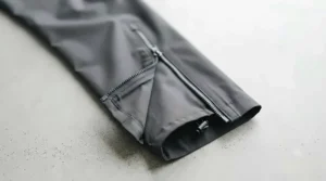 Lightweight, breathable fabric texture of versatile all-season rain pants.