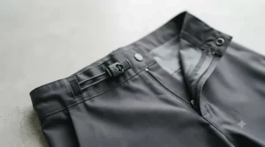 Side zipper vent on rain pants for breathability during humid hikes.