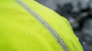 Close-up of sealed seams on a waterproof motorcycle rain suit.