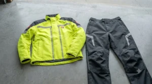 Two-piece motorcycle rain suit offering versatile weather protection.