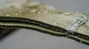 Close-up of waterproof PVC fabric on heavy-duty suit.