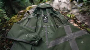 Reinforced taped seams on a high-quality rain poncho for hiking.
