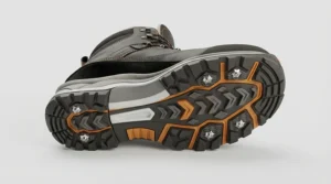 A graphic diagram highlighting the outsole traction technology of ice grip winter boots for icy sidewalks.